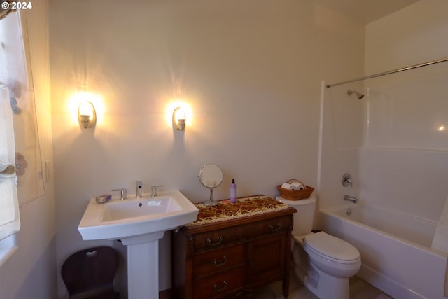 bathroom with toilet and shower / bathing tub combination