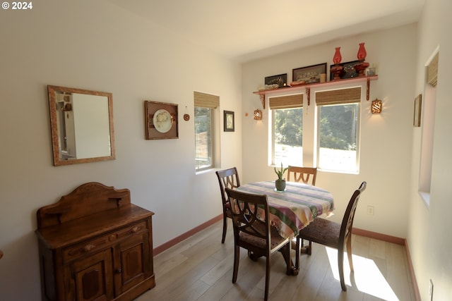 dining space featuring light wood-type flooring