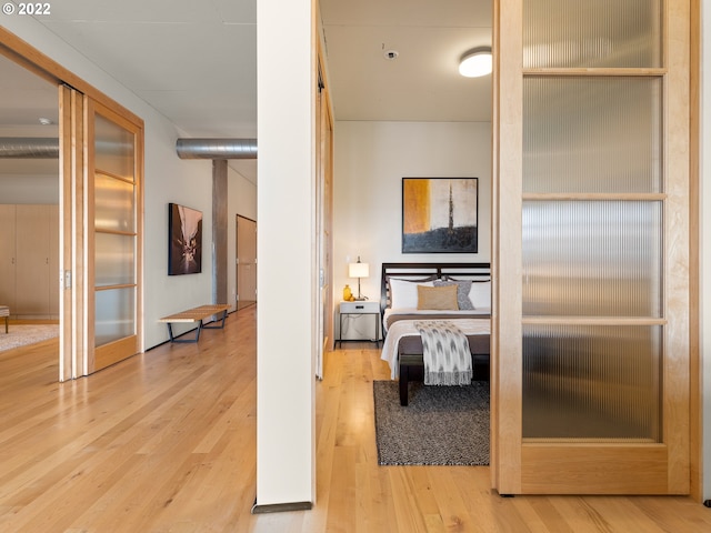 bedroom with light wood-type flooring