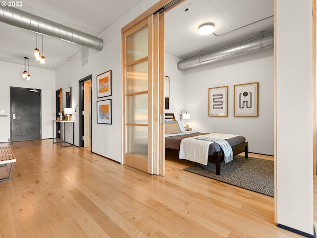 bedroom featuring hardwood / wood-style flooring