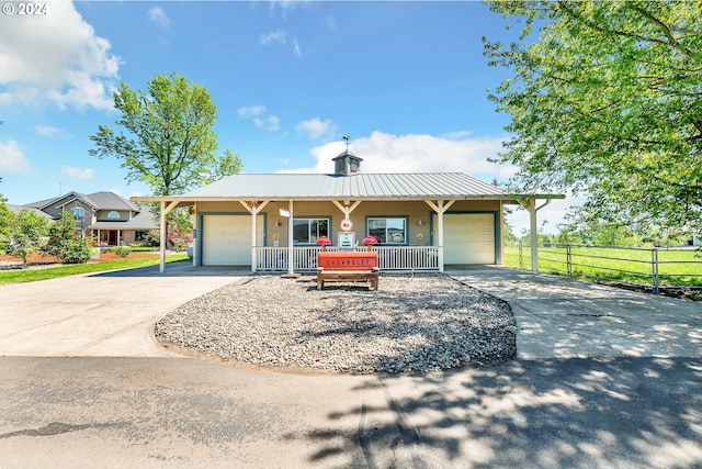 view of front of house with a garage and a porch