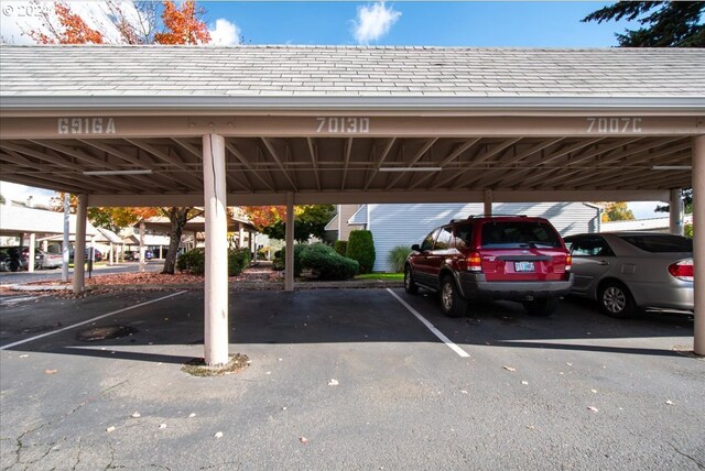 view of parking / parking lot with a carport