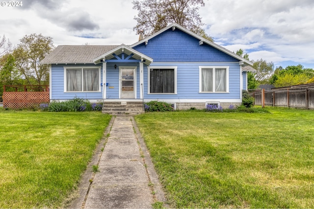 bungalow-style house with a front lawn