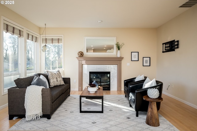 interior space with light hardwood / wood-style flooring and a fireplace