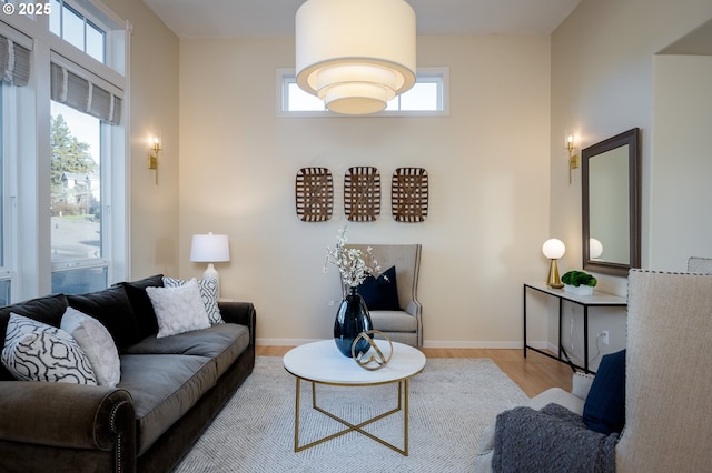 living room with a healthy amount of sunlight and light hardwood / wood-style floors