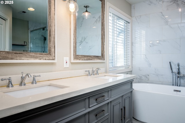 bathroom with vanity and plus walk in shower