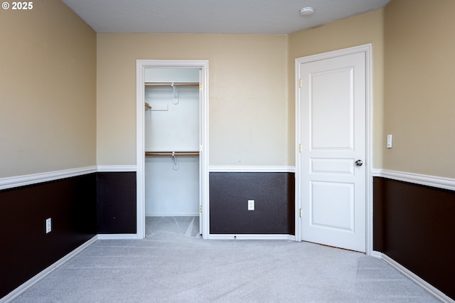 unfurnished bedroom with light carpet