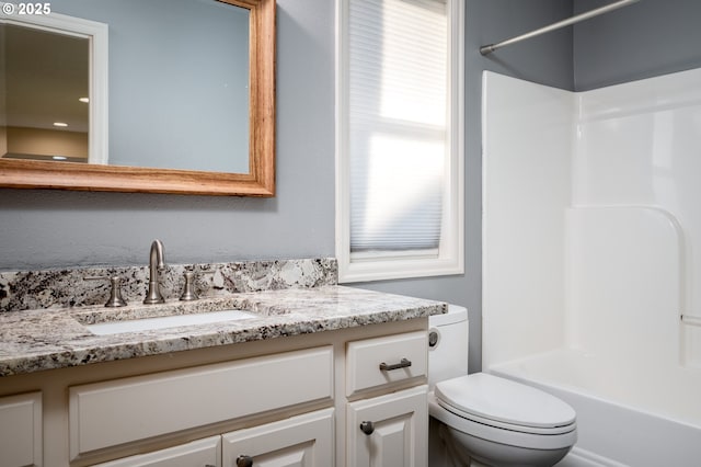 full bathroom with toilet, vanity, and bathtub / shower combination