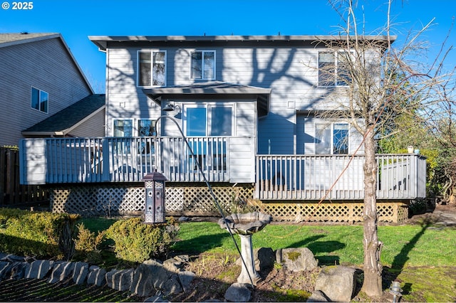 rear view of house featuring a deck