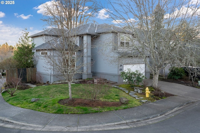 view of property exterior with a garage and a lawn