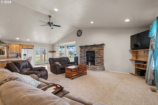 carpeted living room featuring french doors, vaulted ceiling, and ceiling fan