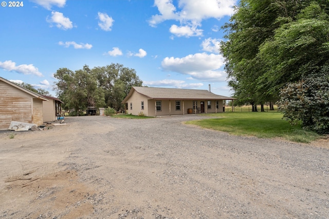 ranch-style house with a front lawn