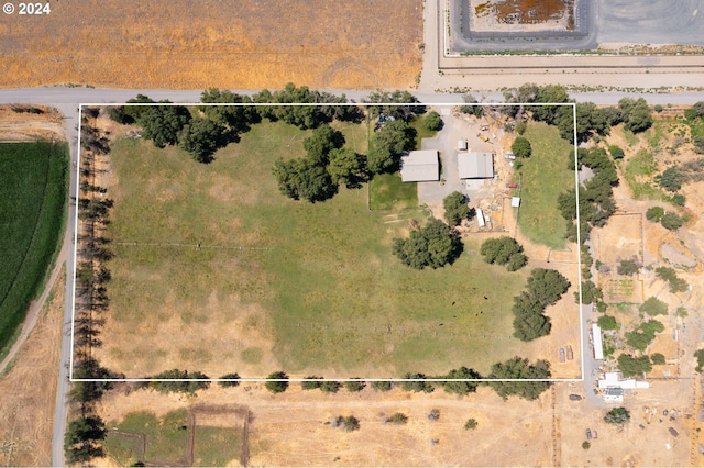 birds eye view of property with a rural view