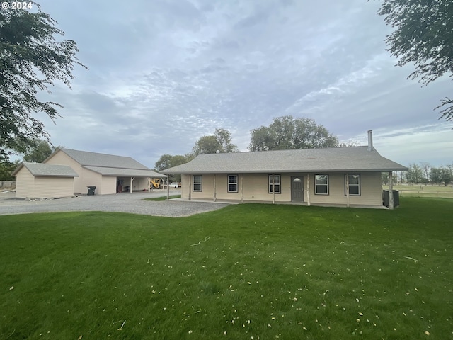 rear view of house with a lawn