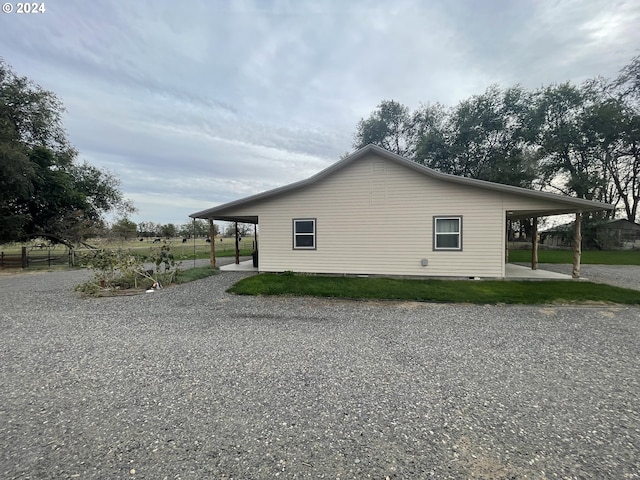 view of home's exterior with a carport