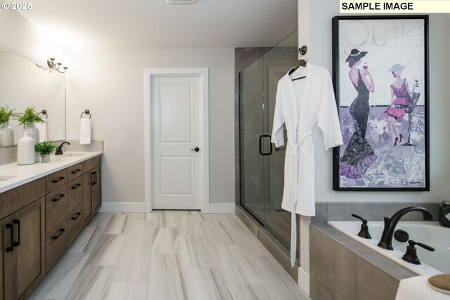 8156 N Hargrave St, Camas, WA 98607 - bathroom featuring double vanity, a stall shower, baseboards, and a bath