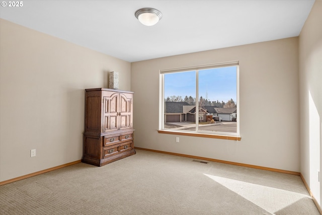 unfurnished bedroom featuring light colored carpet