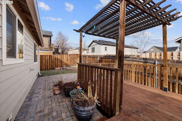 deck featuring a patio area and a pergola