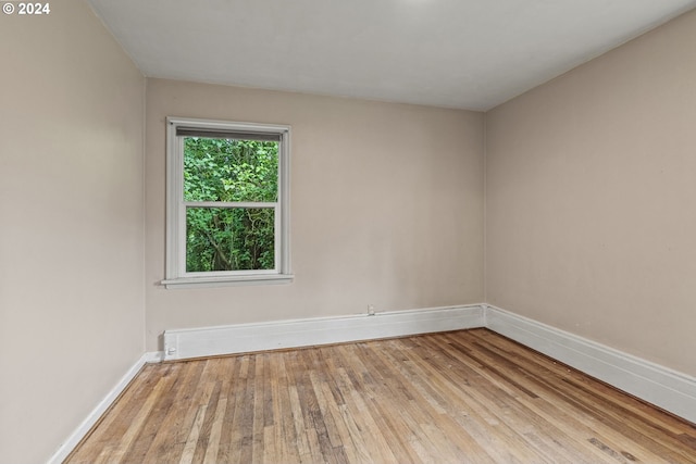 spare room with light hardwood / wood-style floors