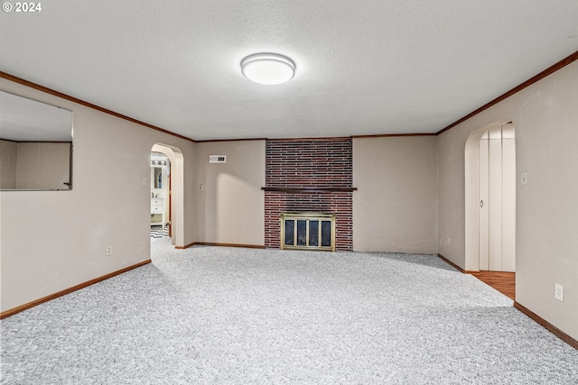 unfurnished living room featuring carpet floors and a brick fireplace