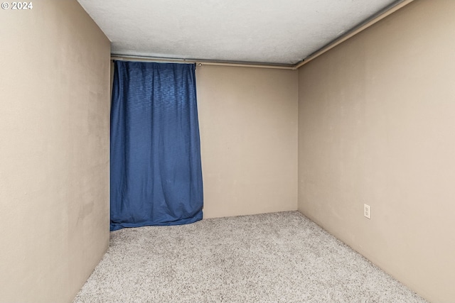 spare room with a textured ceiling