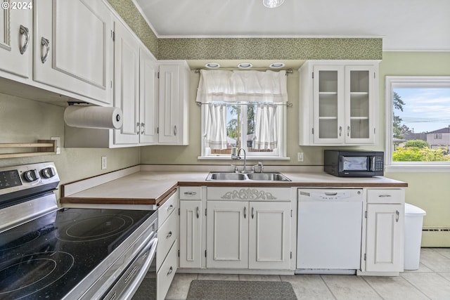 kitchen featuring white dishwasher, stainless steel electric range, white cabinets, and sink