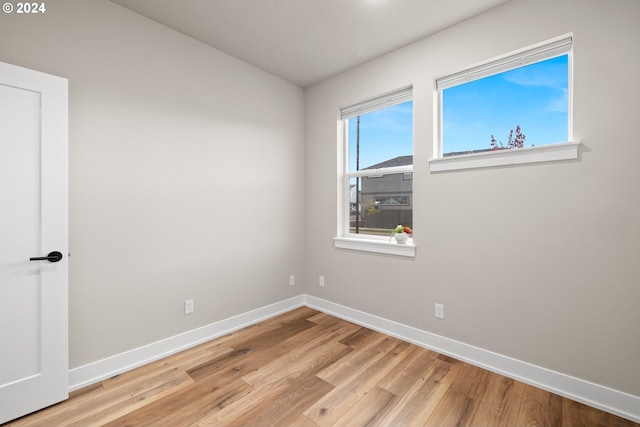 spare room featuring light wood-type flooring