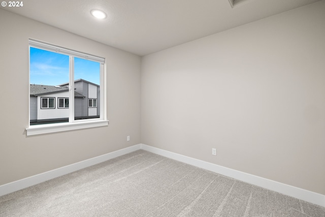 empty room featuring carpet flooring