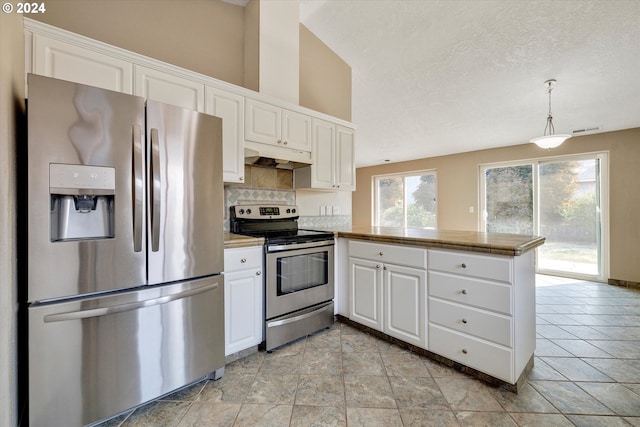 kitchen with white cabinets, decorative light fixtures, stainless steel appliances, and kitchen peninsula