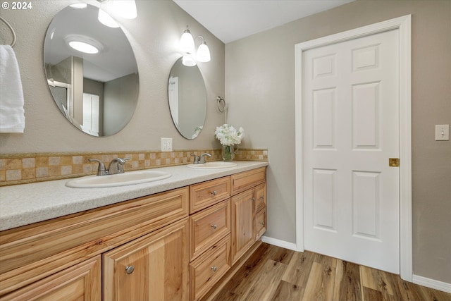 bathroom featuring vanity and wood-type flooring