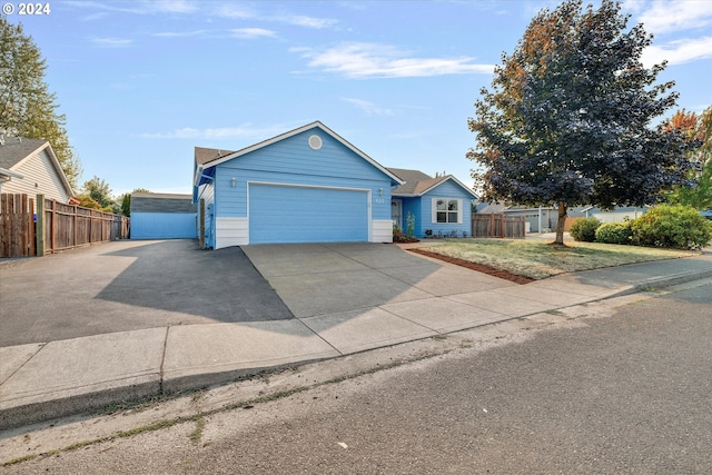 single story home with a garage