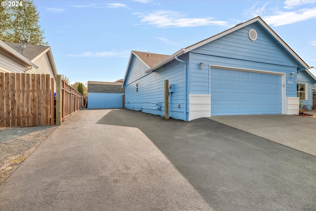 view of side of property with a garage