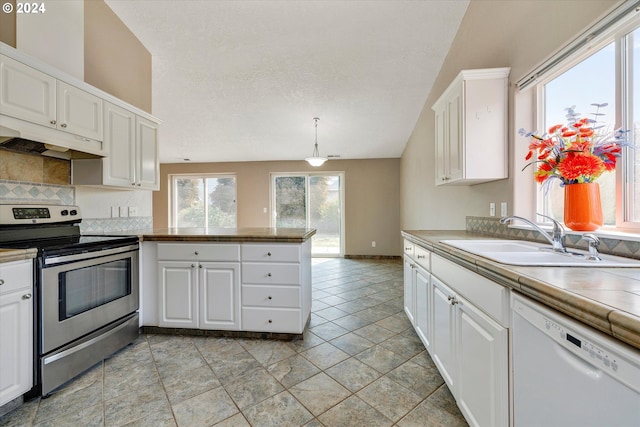 kitchen featuring white dishwasher, sink, white cabinets, and electric stove