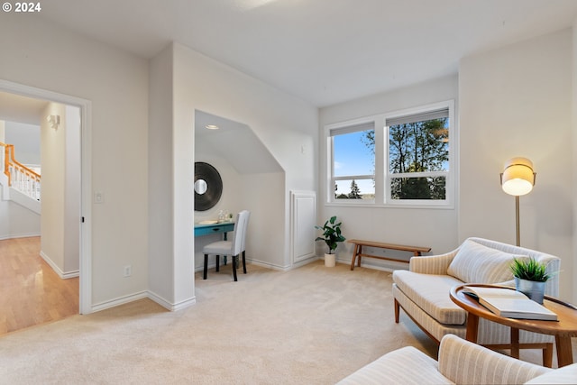 sitting room with light colored carpet