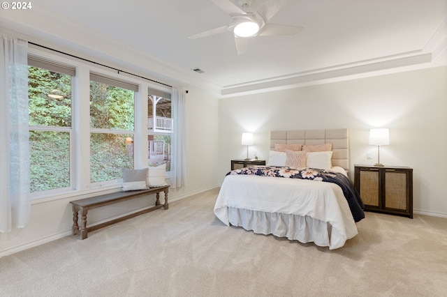 bedroom with light colored carpet, visible vents, ornamental molding, a ceiling fan, and baseboards