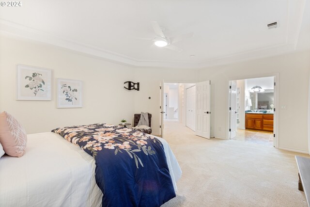 carpeted bedroom featuring ensuite bathroom and ceiling fan