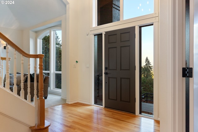 foyer entrance with light wood-type flooring