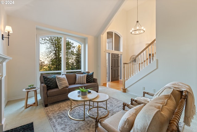 living room with baseboards, a chandelier, stairway, a fireplace, and high vaulted ceiling