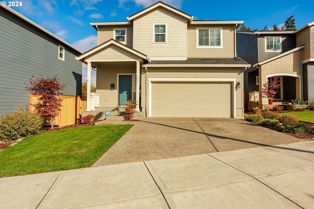 craftsman-style house featuring a front yard and a garage