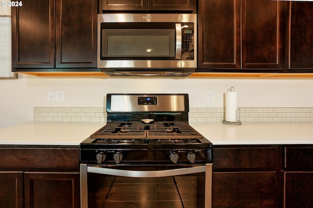 kitchen with stainless steel appliances and tasteful backsplash