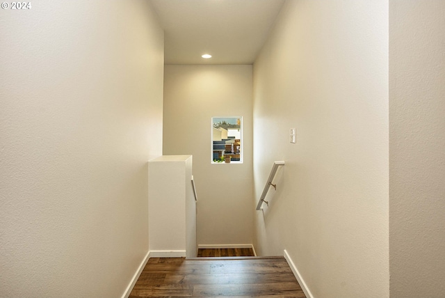 stairs with wood-type flooring