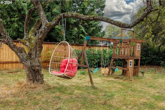 view of jungle gym featuring a lawn