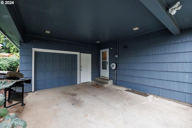 entrance to property featuring a garage