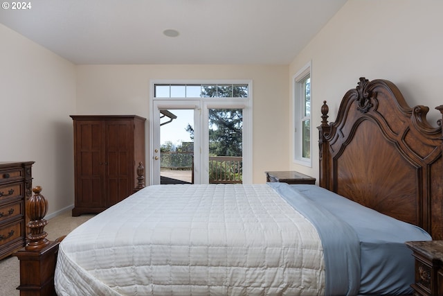 carpeted bedroom featuring access to outside