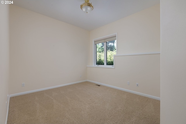 spare room featuring carpet flooring