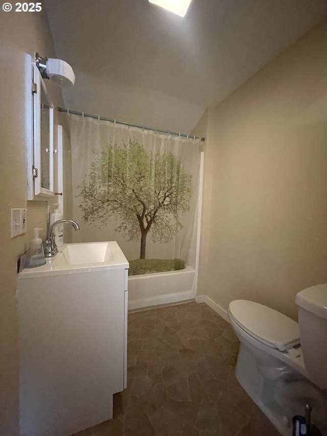 full bathroom featuring toilet, shower / tub combo, vaulted ceiling, and vanity