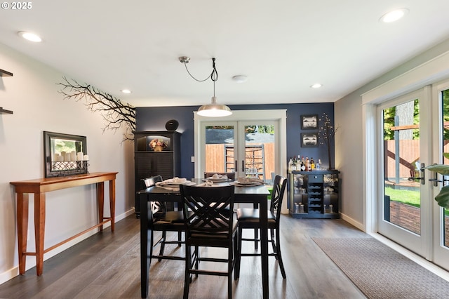 dining area featuring dark wood-style floors, recessed lighting, french doors, and baseboards