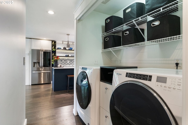 laundry area with washer and dryer, recessed lighting, dark wood finished floors, and visible vents