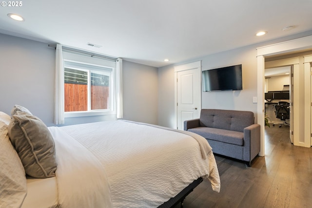 bedroom with hardwood / wood-style flooring, recessed lighting, and visible vents