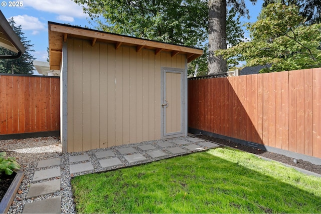 view of shed featuring a fenced backyard